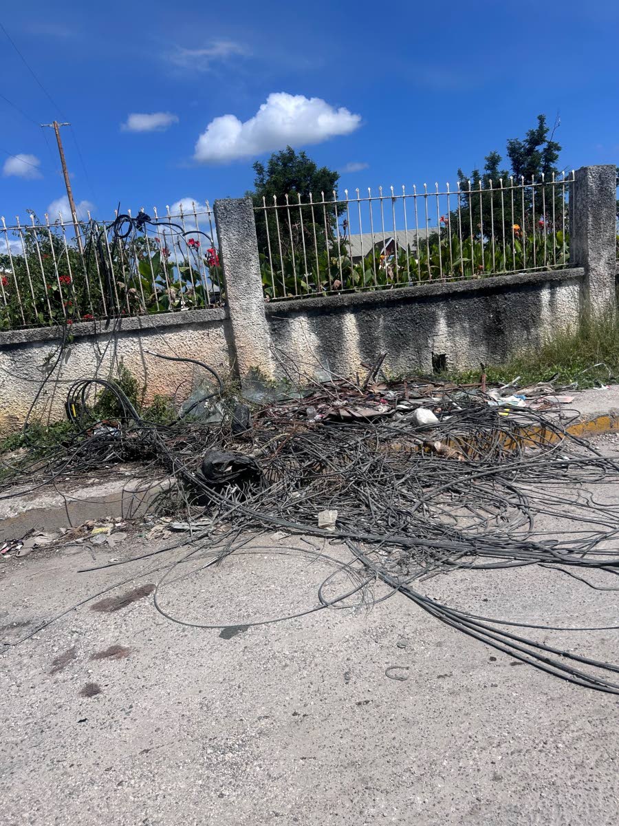 
A tangle of wires on the sidewalk along Lewis Street in Savanna-la-Mar.