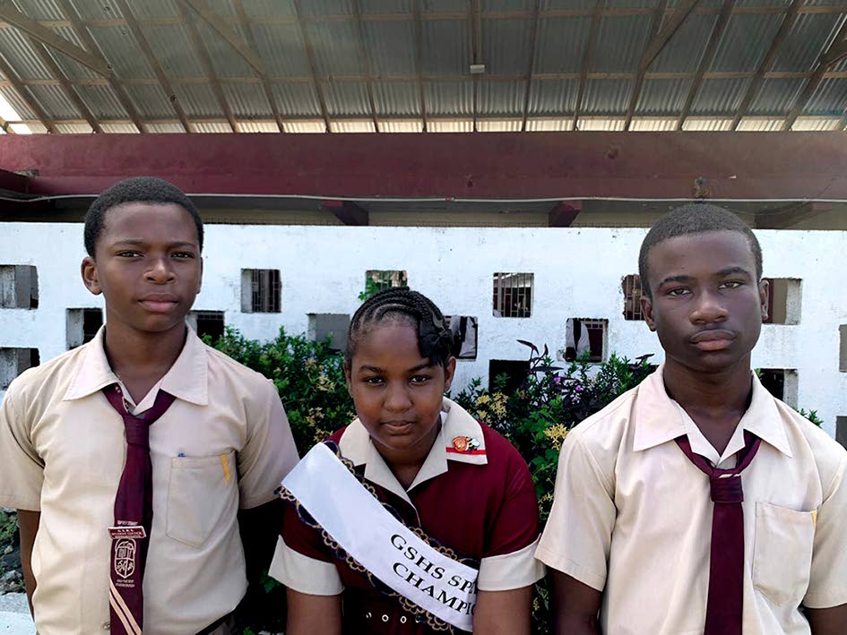 Winner Tahirah Lyn is flanked by Javeem Brown (left), who finished second, and  Kadrae Cunningham, who finished third.