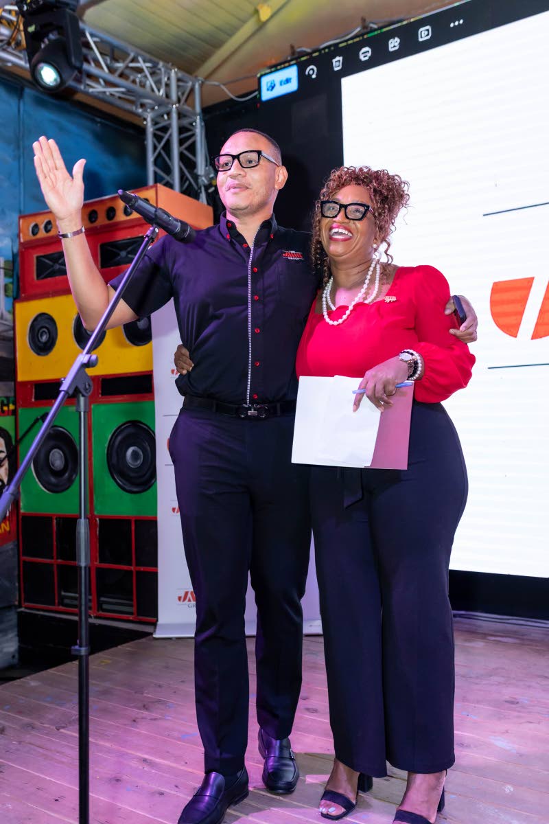 Alwayne Cousins, country chief client partnership officer, JMMB Group, with Carline Porter, financial partnership officer, JMMB Group, at JMMB Group client mixer Cocktails and Conversations.