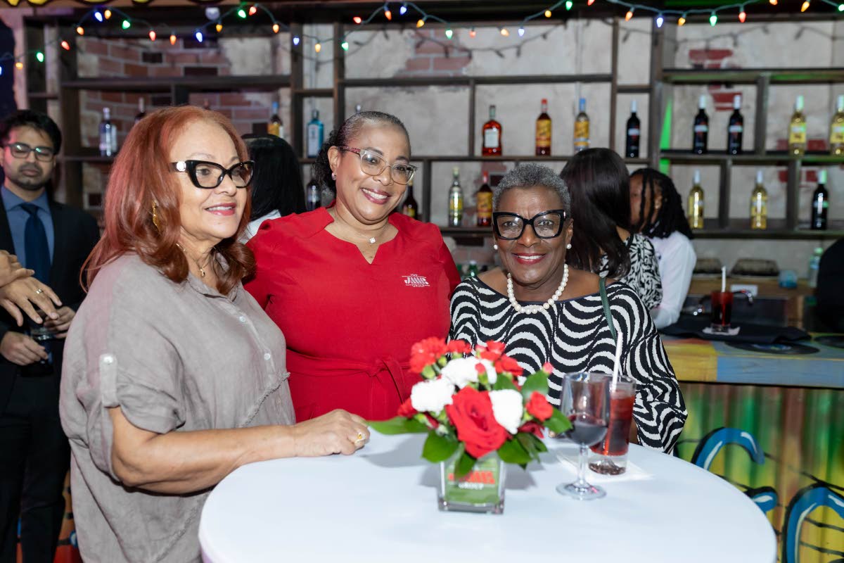 Lisa-Gaye Belcher (centre), financial partnership manager, JMMB Montego Bay, with Heather Turnbull (left), and Launa Alvaranga, at the JMMB Group client mixer Cocktails and Conversations at S Hotel, Montego Bay.