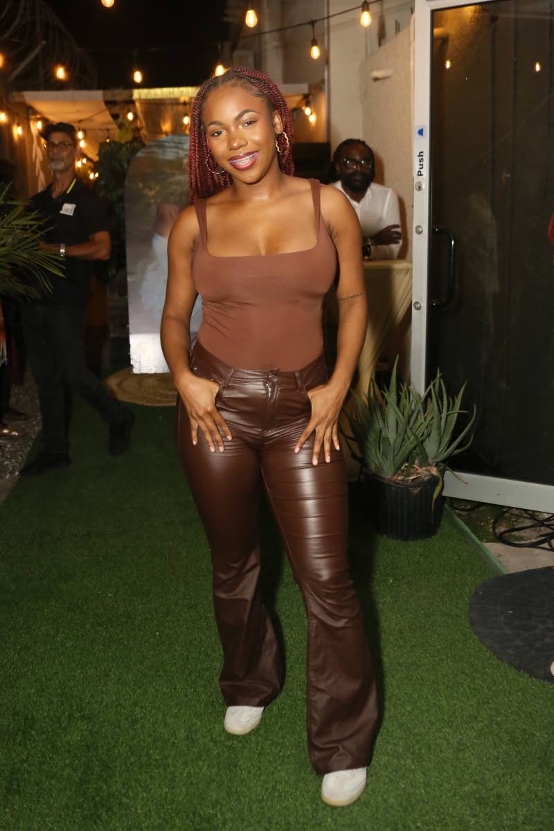 Recording artiste Tori Lattore keeps it neutral in a chocolate bodysuit with matching pants and comfy lowtops.