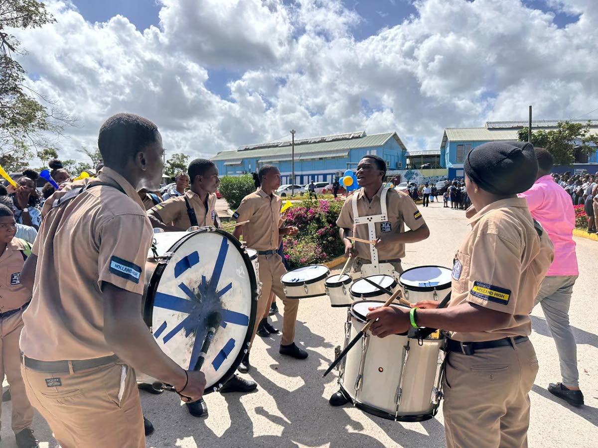A marching band leads celebrations at Holland High as the school honoured Shanoya Douglas’ historic sprint double at the ISSA/GraceKennedy Boys and Girls’ Athletics Championships on March 30, 2026. (Ashley Anguin photo)