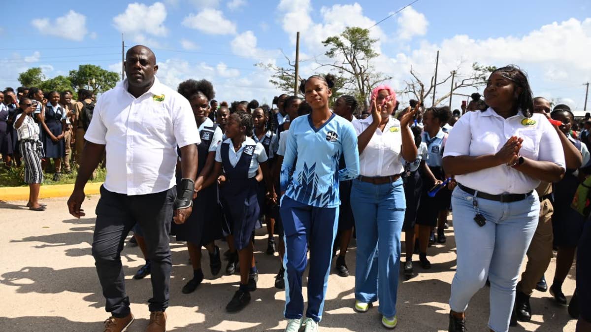 Shanoya Douglas enters the Holland High School grounds in Trelawny to a hero’s welcome following her record-breaking performance at the ISSA/GraceKennedy Boys and Girls’ Athletics Championships on March 30, 2026. (Ashley Anguin photo)