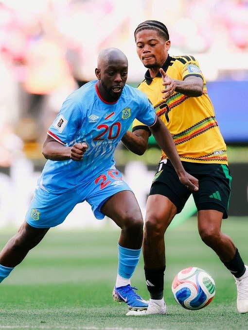 Jamaica’s Leon Bailey (right) and Yoane Wissa of the Democratic Republic of Congo (DR Congo) battle for the ball during the inter-continental World Cup playoff final in Guadalajara, Mexico, on March 31.  DR Congo won 1-0 in extra time to qualify for the 