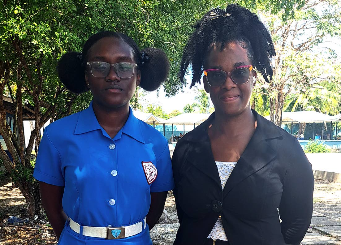 Sherene Smith (right), head of the agricultural science department at St Catherine High School, with grade 11 student Ladona Gordon.