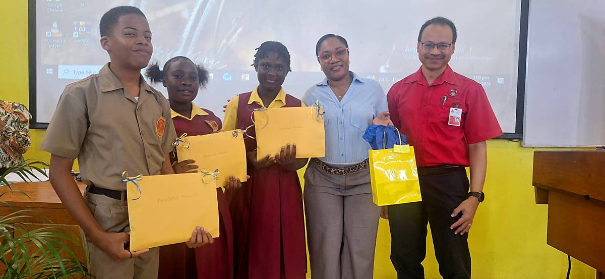 Spanish Town High School teacher Toni‑Ann James‑Robertson (second right) stands with students Hashane Miller, Shanice Wright and Tevesha Turner, alongside their STEM role model, Professor Daniel Coore (right) of Computer Science in the Department of Co