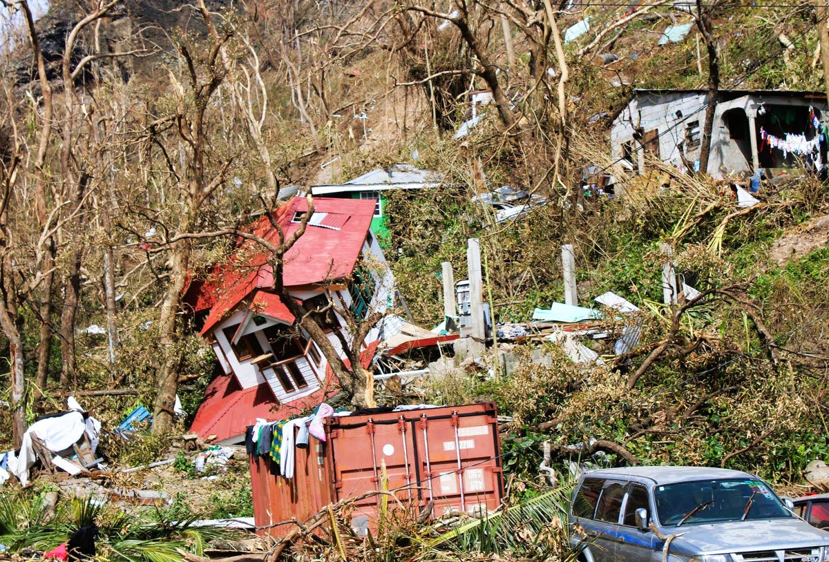 
Homes lay scattered after the passing of Hurricane Maria in Roseau, the capital of the island of Dominica, in September 2017. 