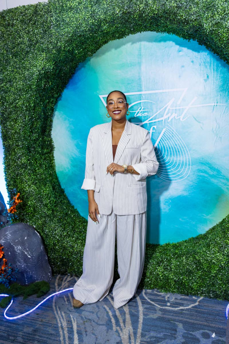 Nicole Hall-Noble, senior manager of commercial marketing at CB Foods, stuns in an oversized pinstriped suit, putting her own twist on business casual.