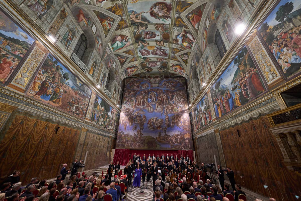 
Conductor Harry Christophers (centre) with tenor Matthew McKinney (left), soprano Elizabeth Watts (second from left), and The Sixteen present Angels Unawares by James MacMillan in the Sistine Chapel at the Vatican, on Sunday, March 22.