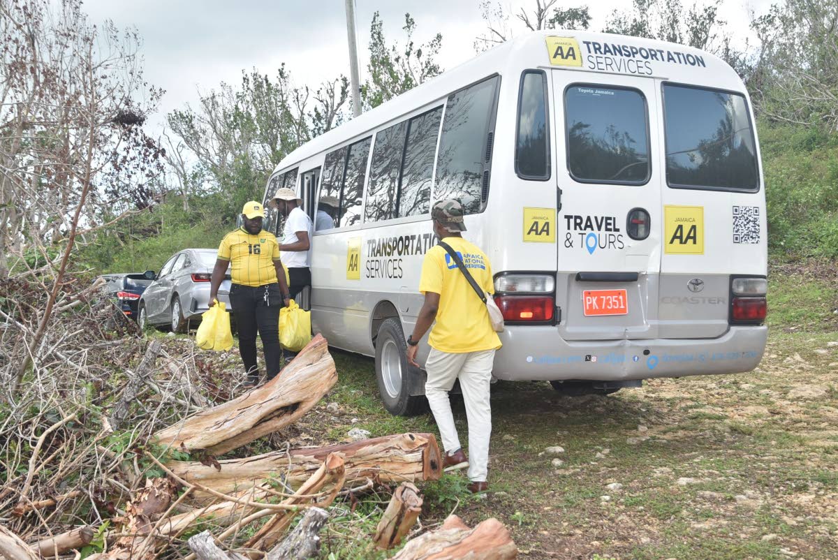 Ramon Smith, a JN volunteer, carries relief packages for residents of Harmony Hall. The JN Foundation with funding from Corus International, an ensemble of faith-based organisations, organised a mission to the community to provide residents, slowly recover