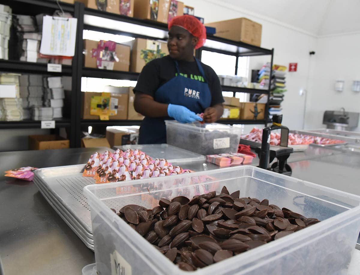 A worker at the Pure Chocolate factory in Ocho Rios, St Ann, prepares products for sale.