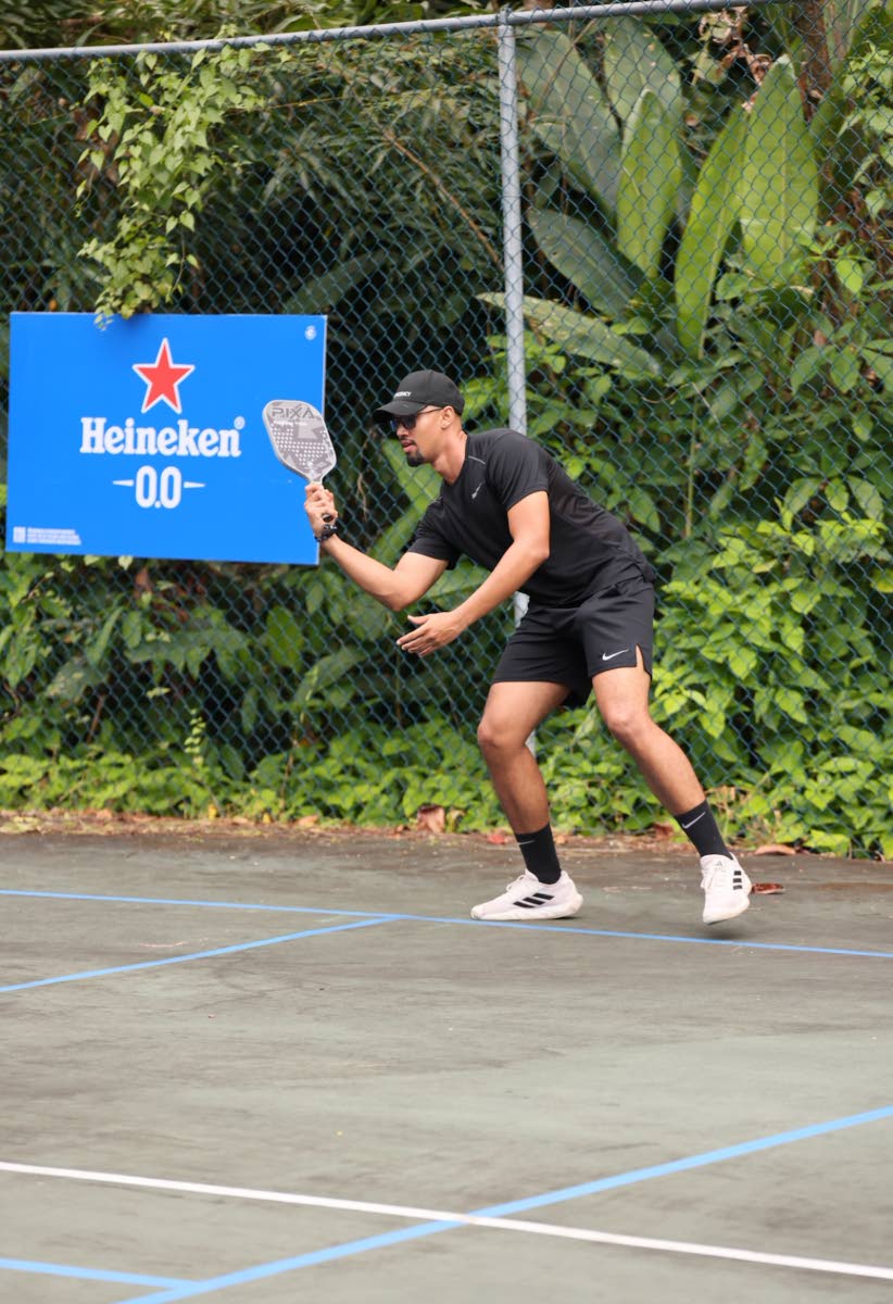 Kristian Chin, real estate agent, shows off his skills on the court.