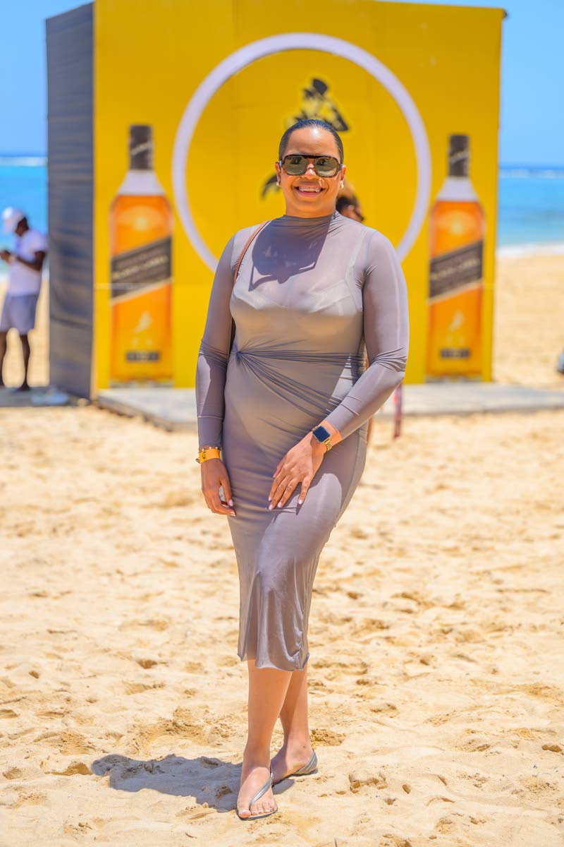Amoye Phillpotts-Brown, brand manager, Red Stripe, pauses her stroll on the shores to pose for the lens. 