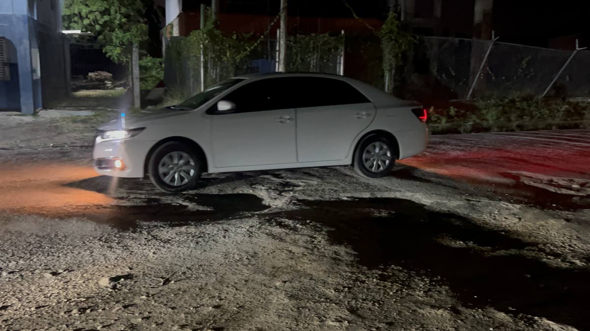 A motorist struggling to navigate the terrible road conditions in Strathbogie.