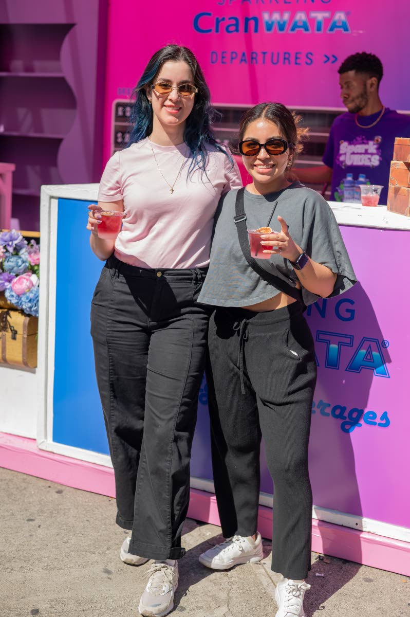 Besties Anakaren Rivas (left) and Daniela Salmon pause from sipping cocktails to share lens time.