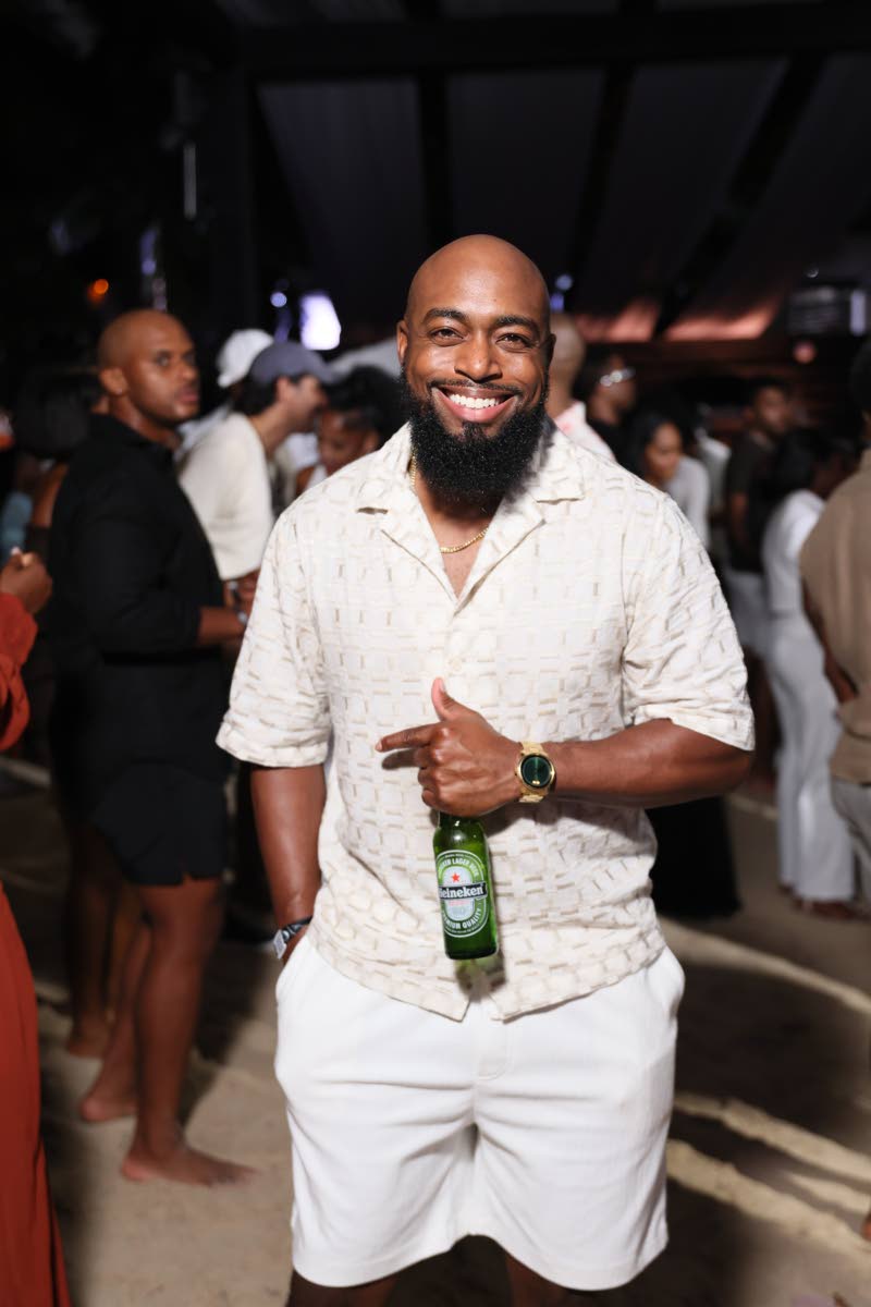 Merrick Marshall, finance strategic controller at Red Stripe, enjoys a cold brew.