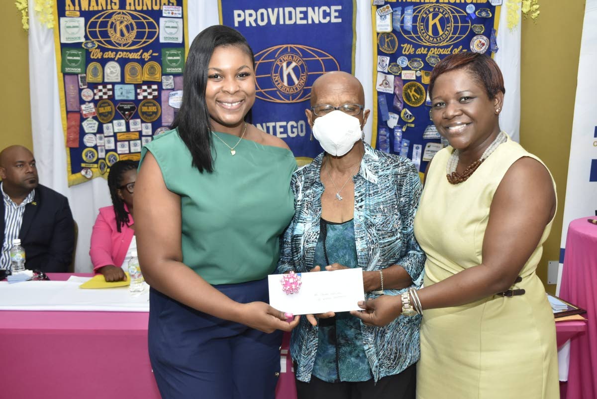 Llauna Gordon Humphries (centre), coordinator for the Montego Bay Cancer Support Group, accepts a cheque valued at $.3.24 million from Jahniel McFarlane (left), of Harbour City Shopping Centre, and Giscle Waldron, president-elect of the Kiwanis Club of Pro