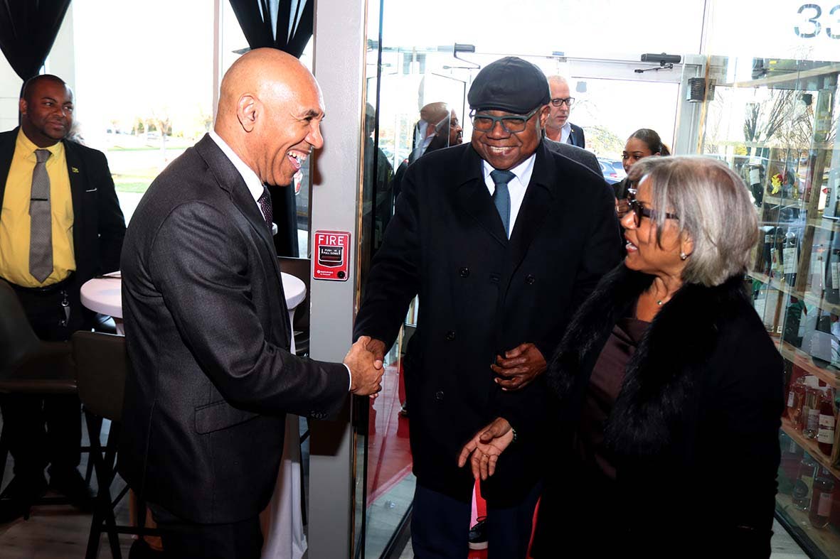 Tourism Minister Edmund Bartlett and his wife, Carmen, are greeted by Jamaica’s Ambassador to the United States, Major General (Ret’d) Antony Anderson (left), at Catherine’s Restaurant in Laurel, Maryland, ahead of the Jamaica Tourist Board Travel Ad