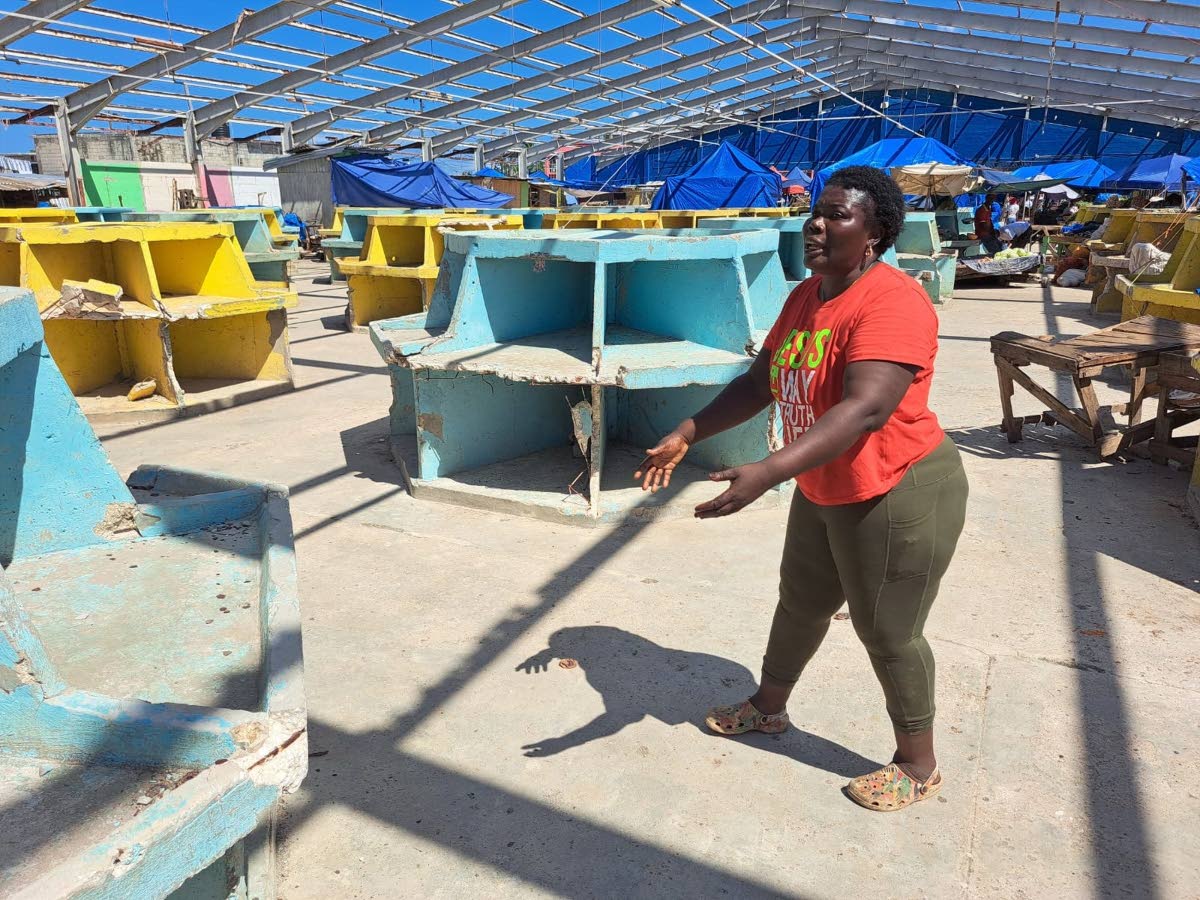 Jodian Clarke, a vendor at the Charles Gordon Market in Montego Bay, St James, points out the current conditions inside the market.