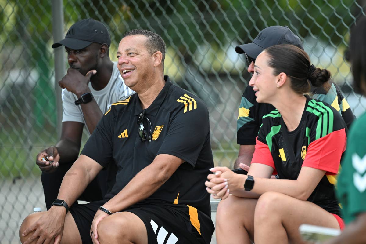 
National Women’s coach Hubert Busby Jr with his coaching staff at the Jamaica Women’s Premier league encounter between Cavalier and UWI at the Alpha Institute yesterday.