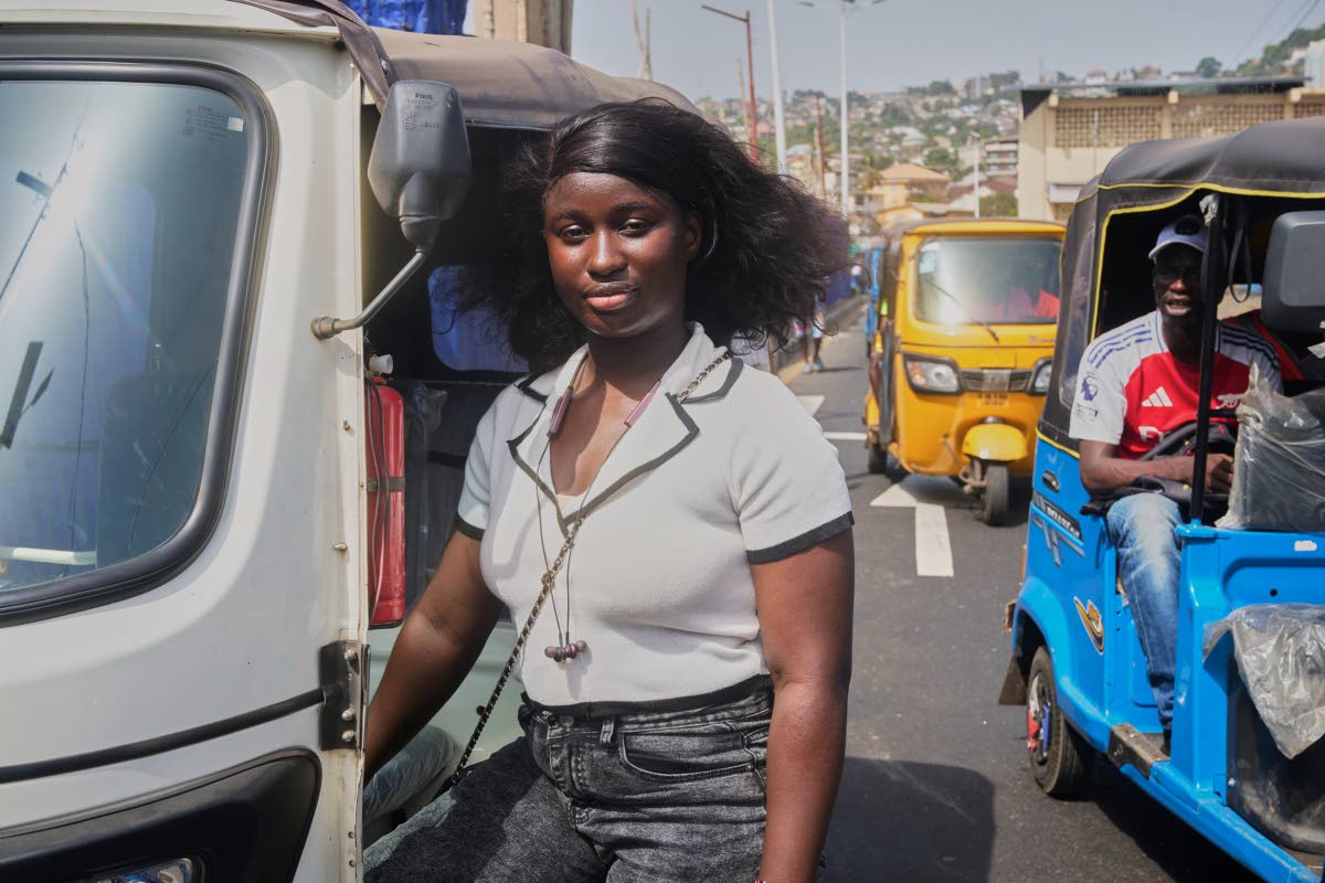 Halimatu Kamara, a rickshaw driver, poses for a portrait in Freetown, Sierra Leone.