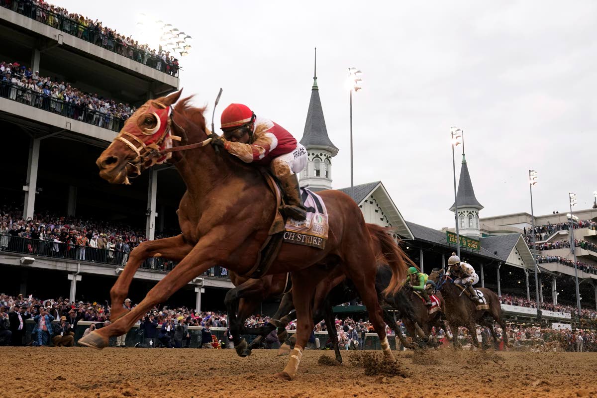 Rich Strike (foreground), with Sonny Leon aboard, wins the 148th running of the Kentucky Derby at Churchill Downs in 2022.