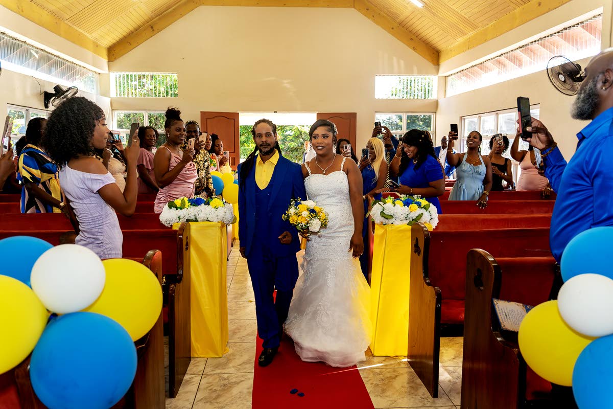 The bride was happy to have her brother, Donnovan Douglas, escort her up the aisle on her wedding day.