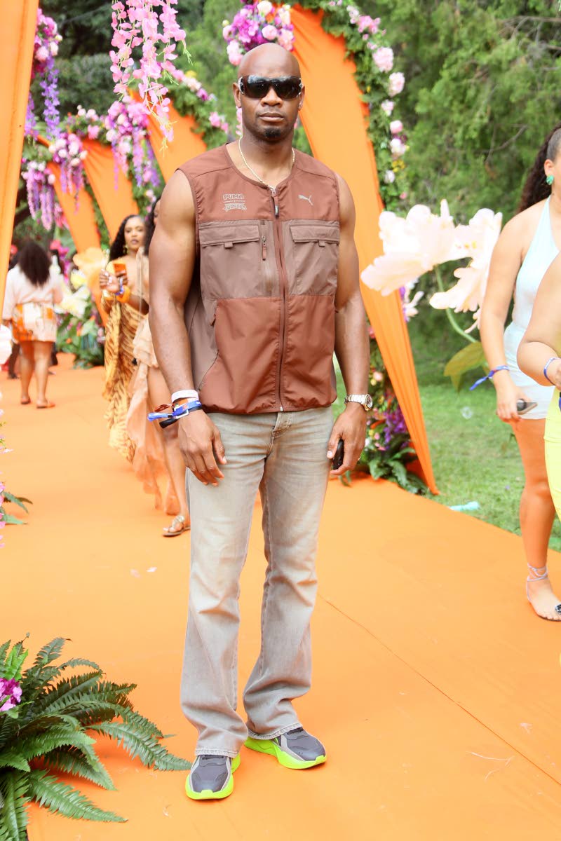 Sprint icon Asafa Powell opts for a relaxed look in a sleeveless Puma vest and fitted jeans