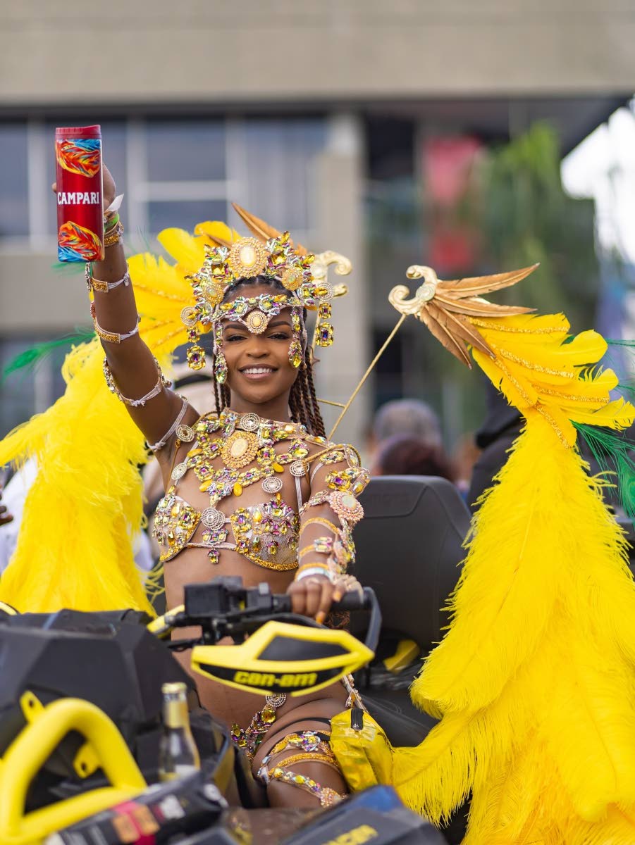 Winner of the Campari Xodus Carnival Sprint costume Hanna Richards raises her drink to a good day.