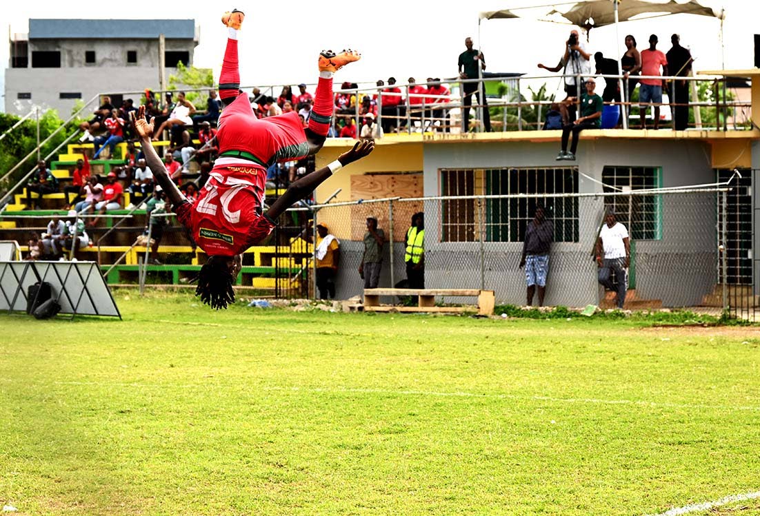 Montego Bay United’s Deonjay Brown somersaults as he celebrates scoring against Spanish Town Police FC during the Jamaica Premier League football game at Jarrett Park in Montego Bay on Sunday.