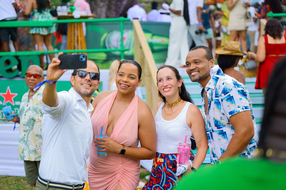 From left: Red Stripe Managing Director Daaf van Tilburg, Brand Manager Amoye Phillpotts-Brown, Laura van Tilburg and Heineken Brand Manager Nathan Nelms, capture the moment on camera.