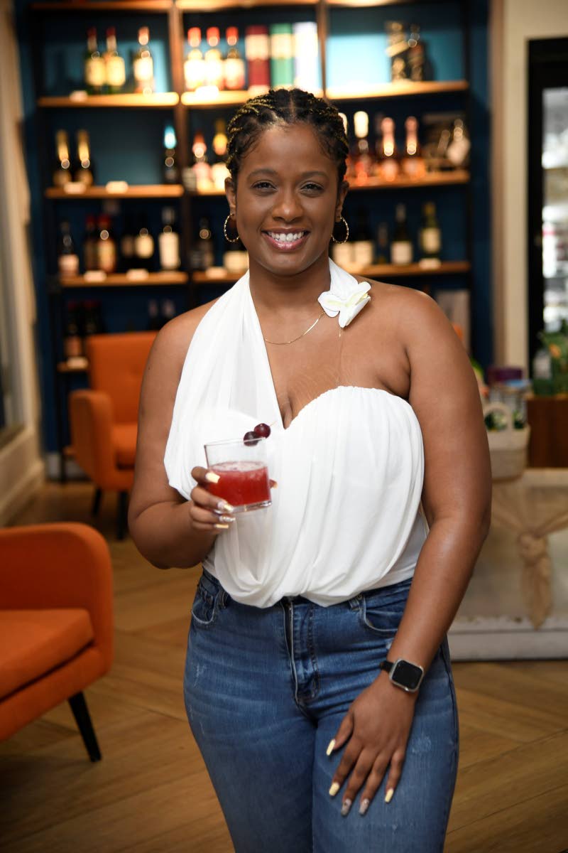 Kimberlee Rose, brand manager for spirits and wines at Caribbean Producers Jamaica Limited, poses with the Tennessee sling — an ounce of lime juice, half an ounce of orange liqueur, one ounce of mixed berries syrup and two ounces of Jack Daniel’s Tenne