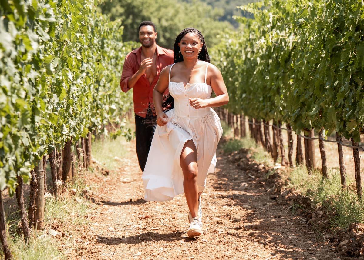 Halle Bailey, who plays Anna and Regé-Jean Page as Michael, in a scene from ‘You, Me & Tuscany’. 
