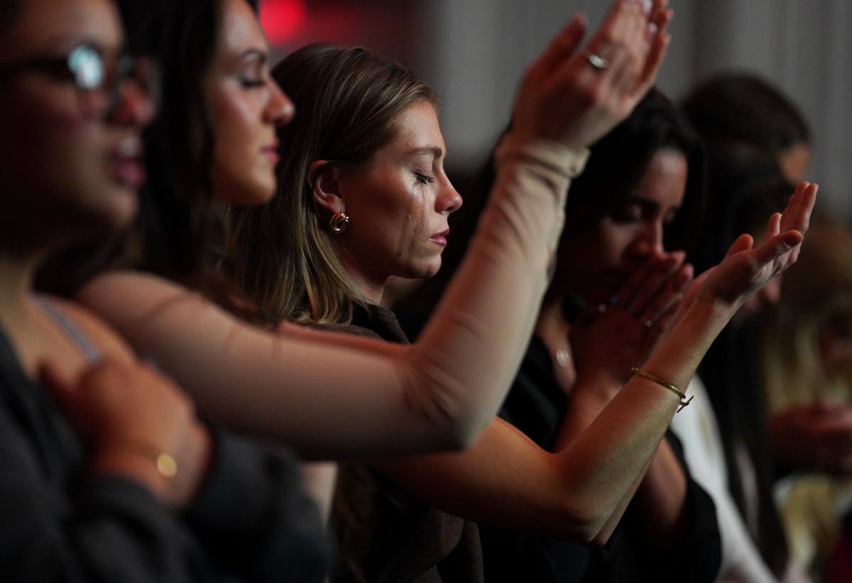 Followers of the Christian podcast, “Girls Gone Bible,” cry during the live show held at the Atlanta Symphony Hall, Nov. 14, 2025, in Atlanta.