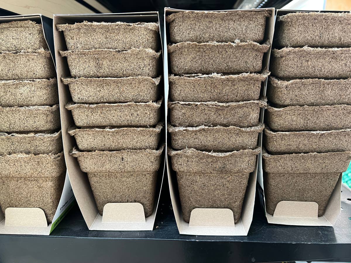 Packages of plastic-free, manure-based planting pots.