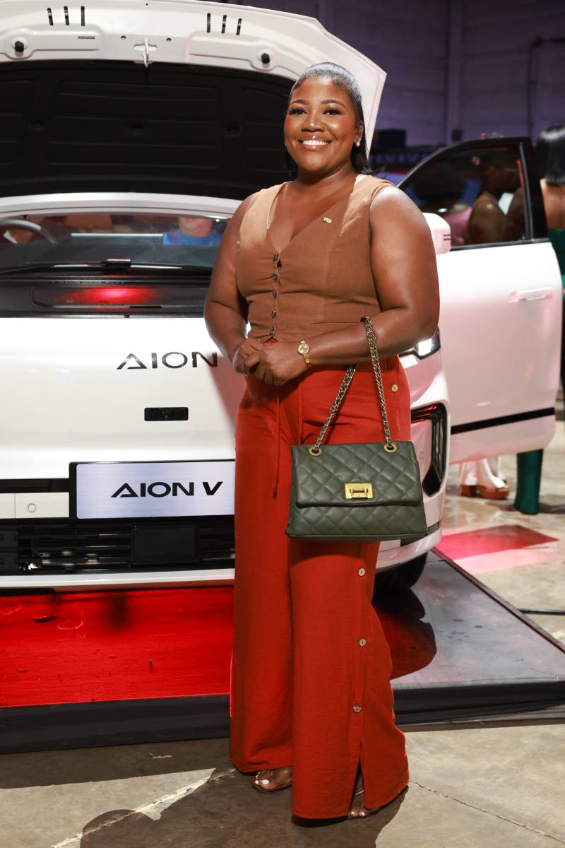 Chantal Jamieson, marketing projects officer at National Commercial Bank, pairs a russet vest with red trousers. 