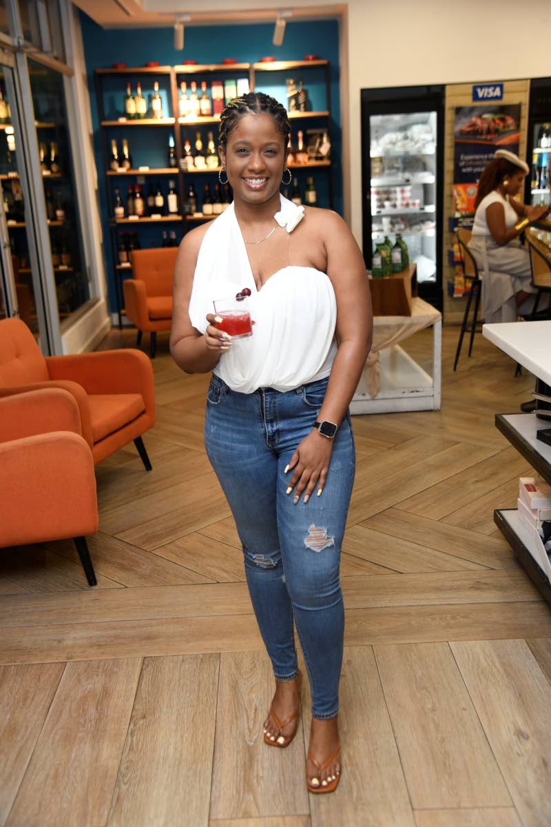 With the Tennessee sling drink in hand, Kimberlee Rose, brand manager for wines and spirits at Caribbean Producers Jamaica, is all smiles for the camera.
