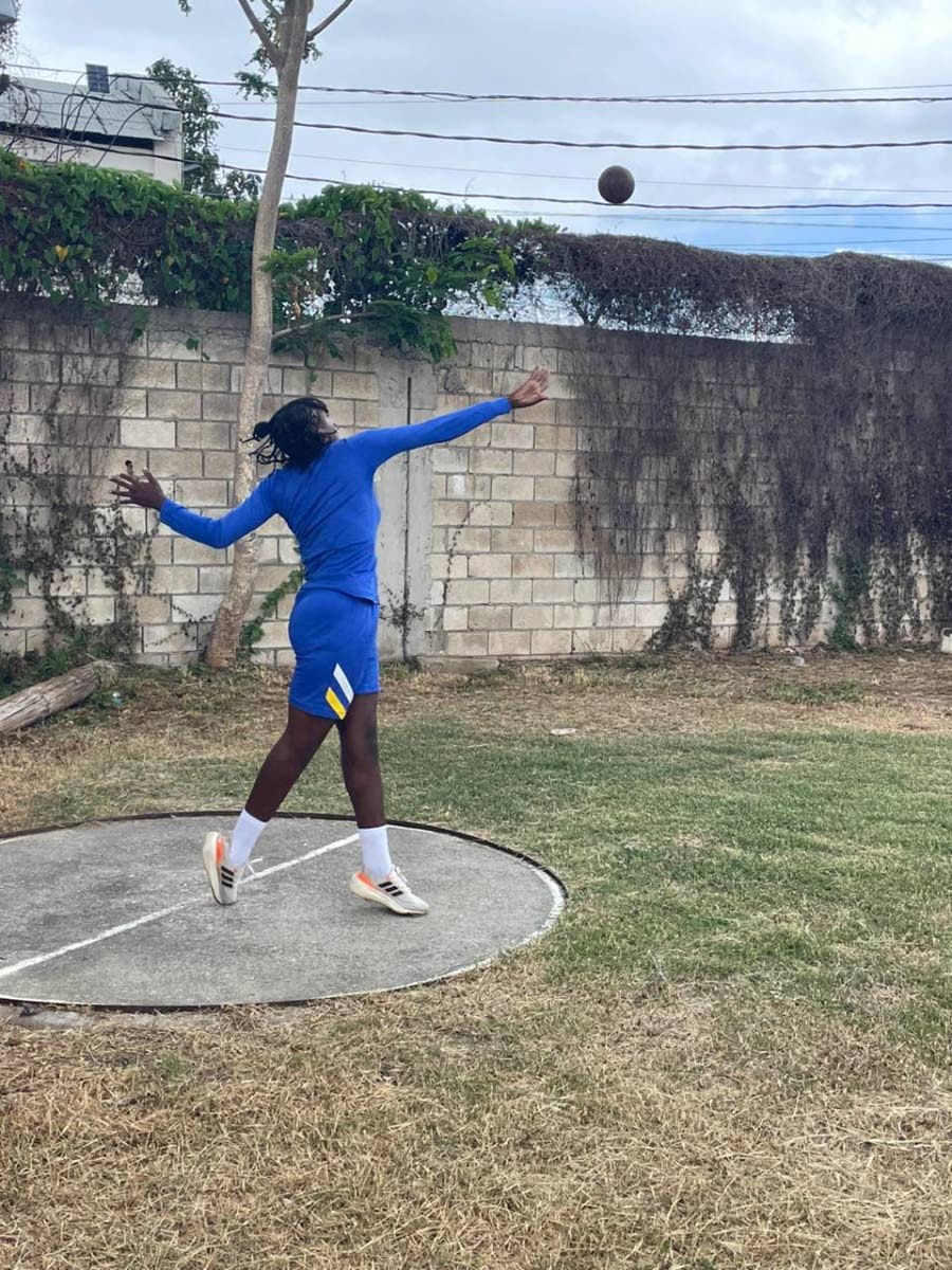 Brianna Car throws the shot put.