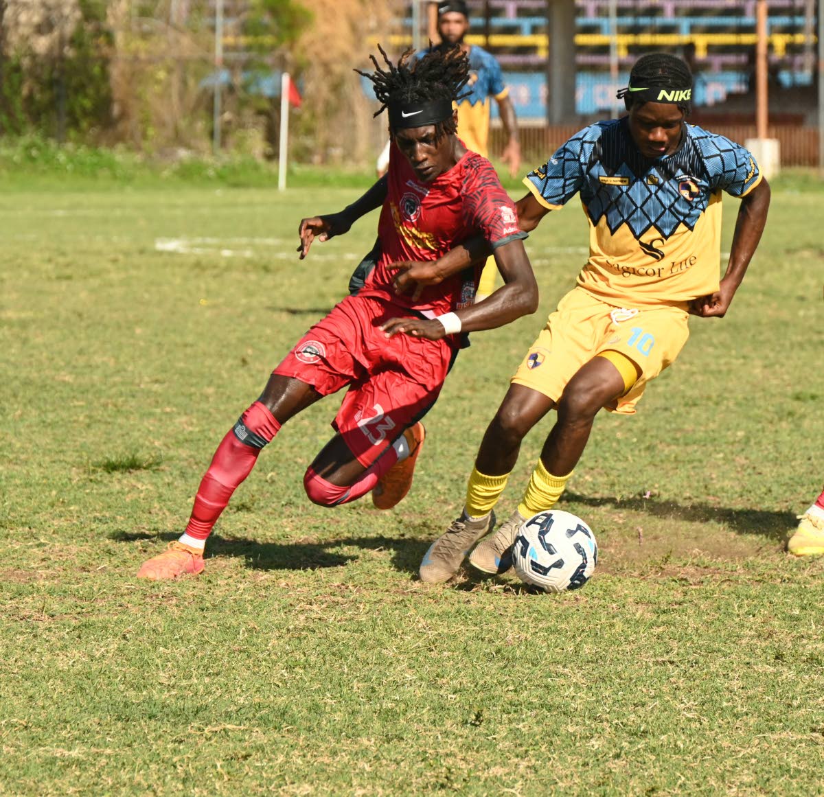 Montego Bay United’s Deonjay Brown (left) and Racing United’s Nickyle Ellis battle for the ball during their Jamaica Premier League game at Jarrett Park in Montego Bay on Sunday. Montego Bay won 4-1.