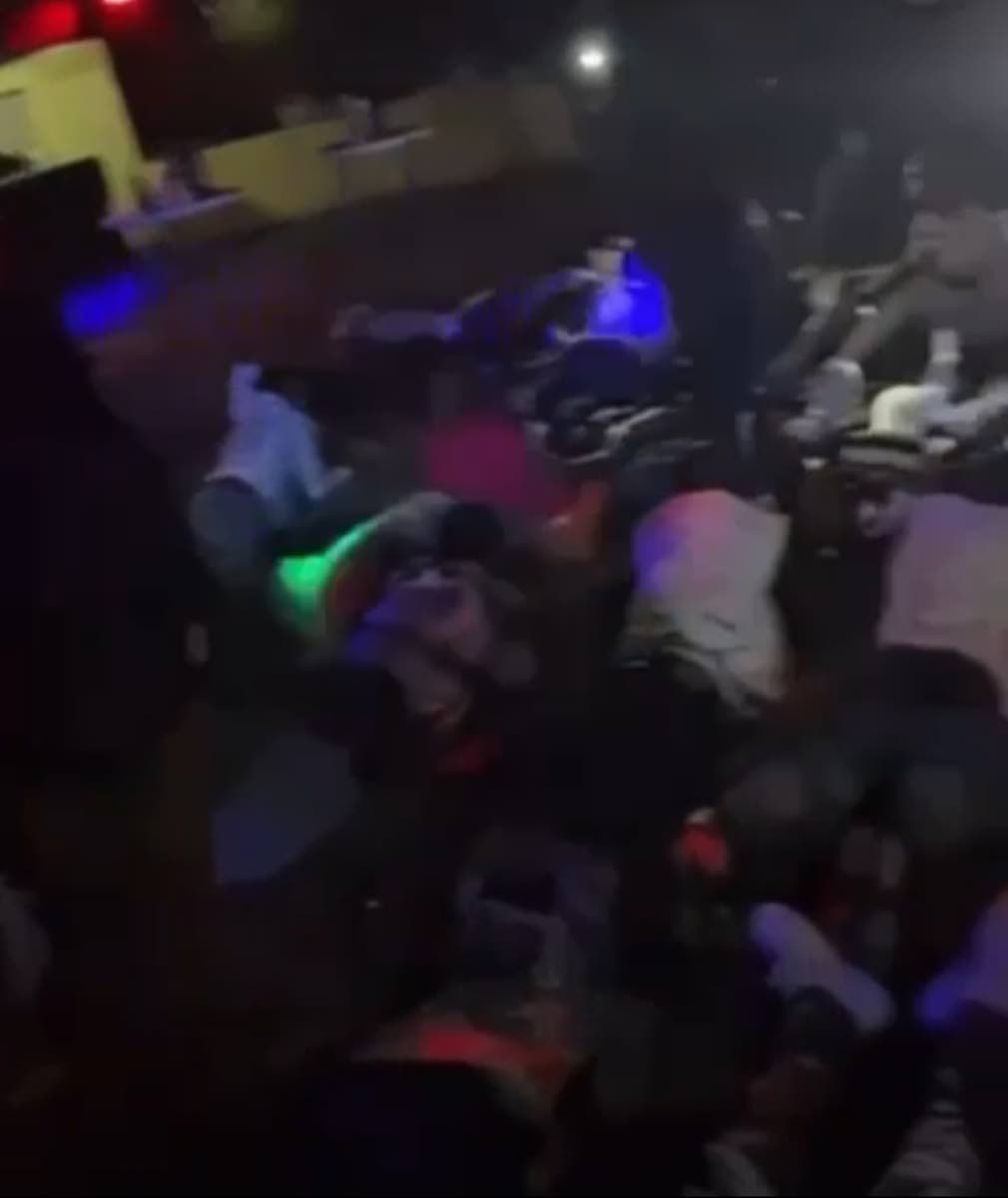 Patrons lay flat in Mt James, St Andrew venue as directed by police. The police swooped down on the venue in search of wanted men and illegal firearms.