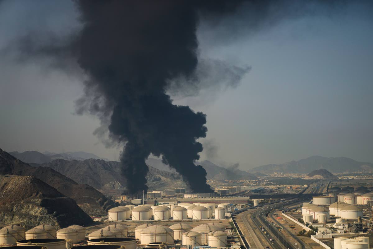 Plumes of smoke rise from an oil facility in Fujairah, United Arab Emirates, Saturday, March 14, 2026. 
