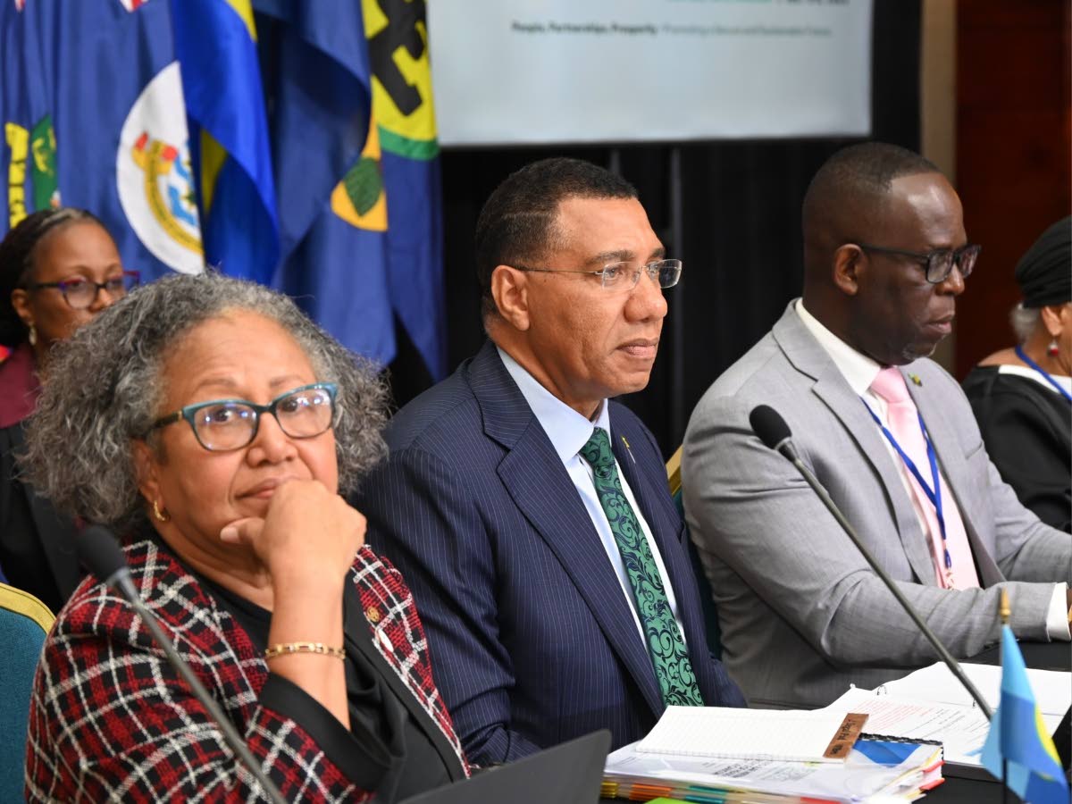 Prime Minister Dr Andrew Holness (centre), Dr Carla Barnett, Secretary General of the Caribbean Community (CARICOM)  (left), and Dr Amstrong Alexis, Deputy Secretary General of the CARICOM, during a Plenary Business Session at the 49th Regular Meeting of t