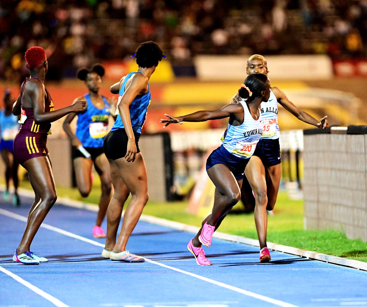 Edwin Allen (right) making the final baton exchange on the 4x400m open girls relay final ahead of Hydel High (centre) and Holmwood Technical at the ISSA GraceKennedy Boys’ and Girls’ Athletics Championships at the National Stadium in St Andrew, Jamaica