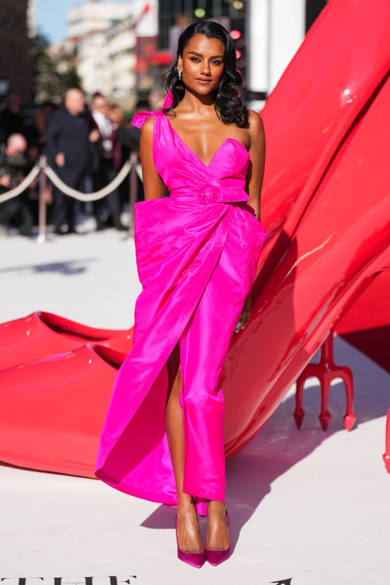 Simone Ashley stuns in archival Mugler – a one-shoulder fuchsia dress from Thierry Mugler’s 1984 resort collection.