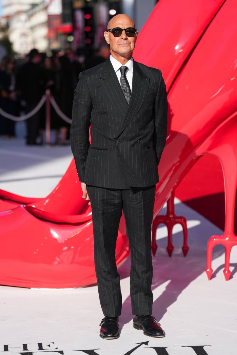 Stanley Tucci keeps it sharp in a pinstripe suit by Paul Smith.
