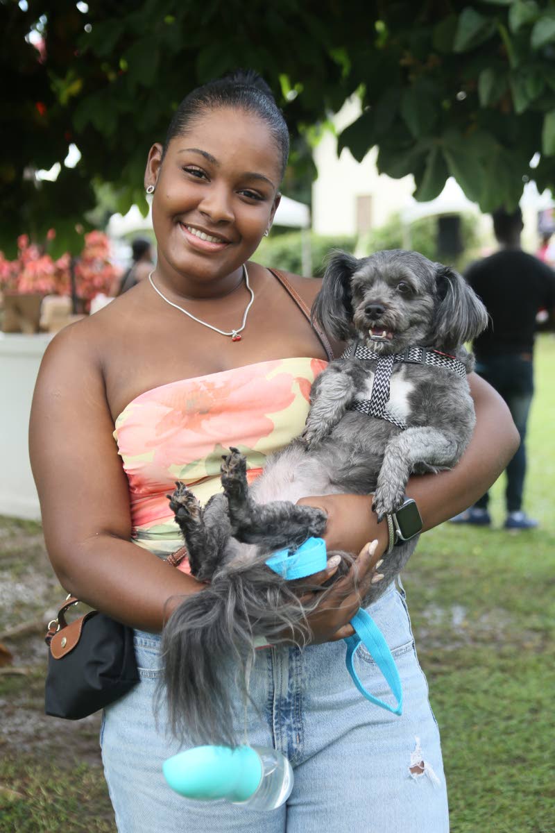 First-time Yappy Hour attendee, Leesa Schaaffe, cuddles her Shih Tzu–Pomeranian Bella.