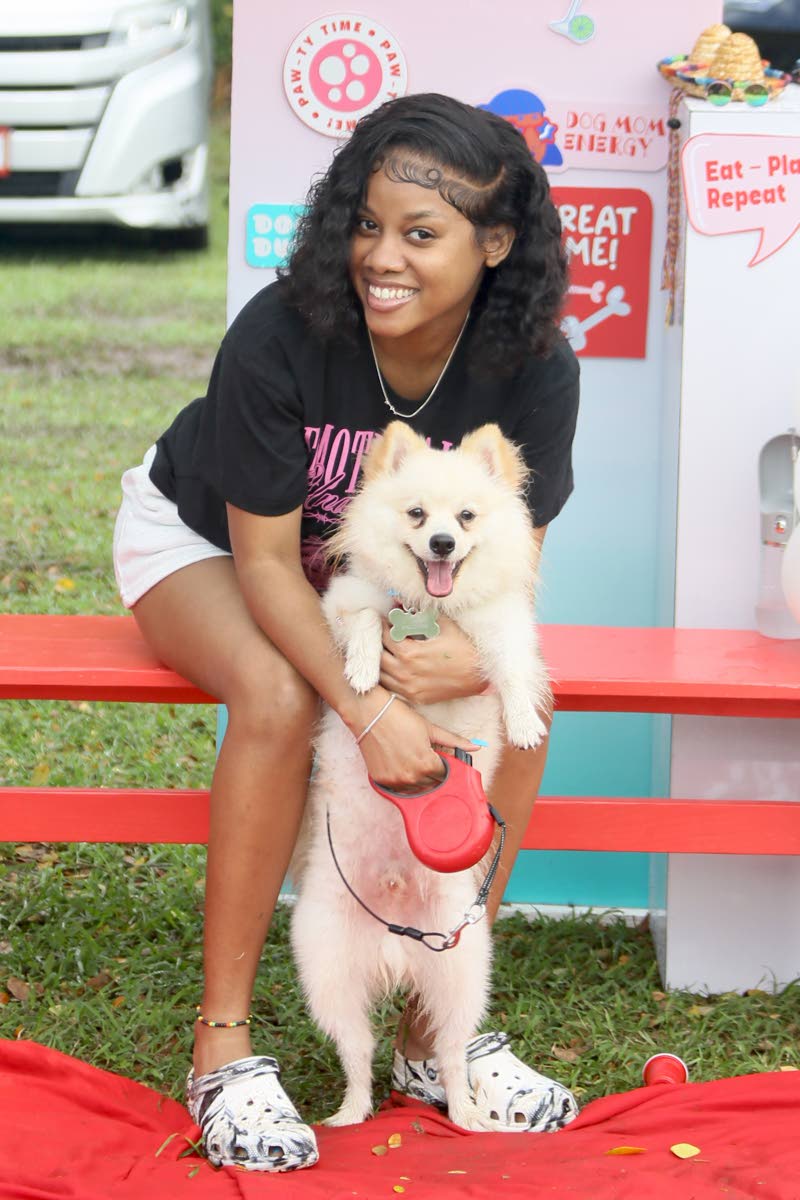 Camera-ready is one-year-old Pomeranian Dembe, who is all smiles with his owner, Jahmealia Stephenson.