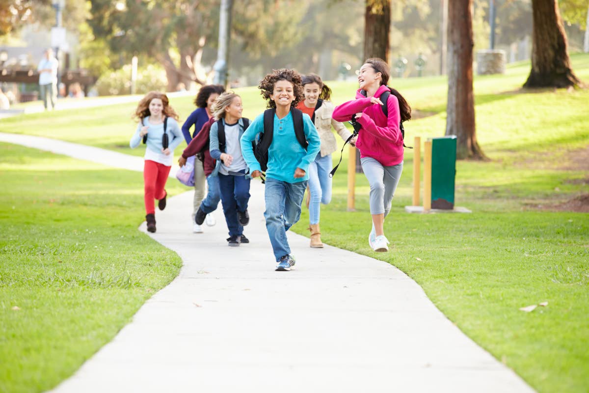 Representational image of children running in a park