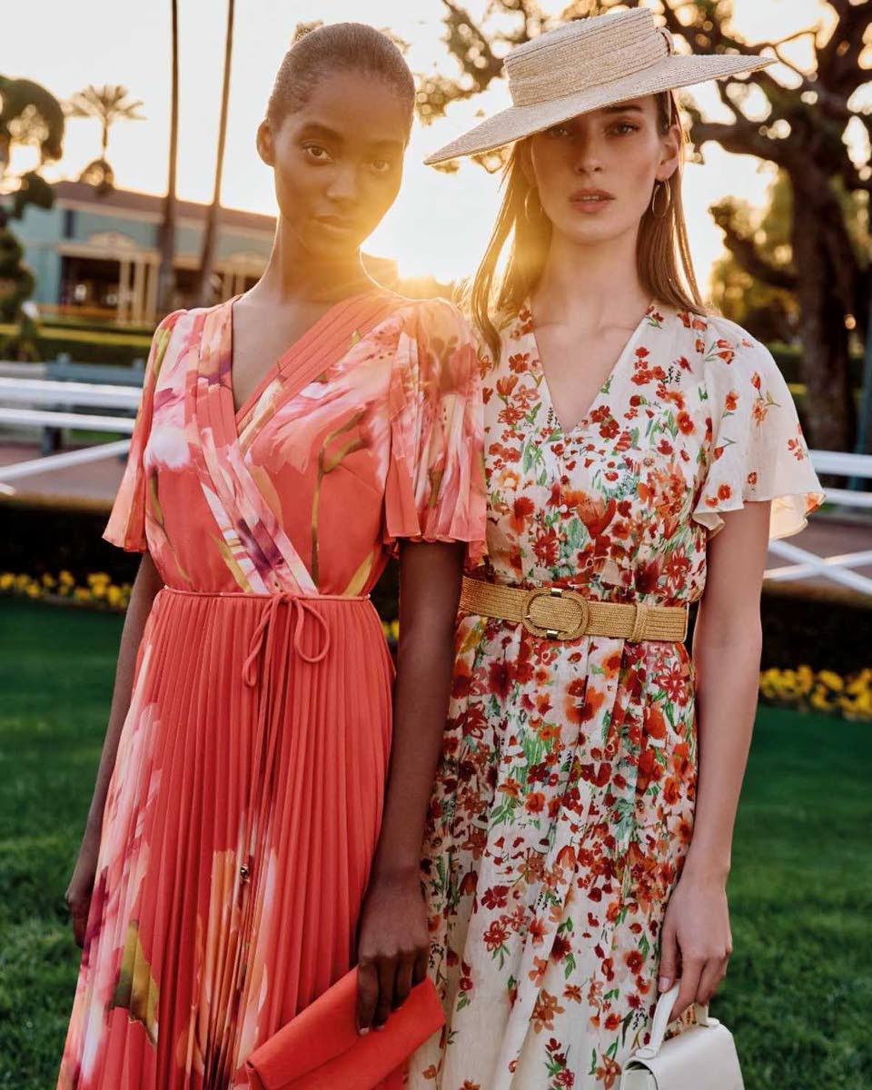 Tami Williams (left) sports the pleated Abigail maxi dress, which features a v-neckline and a faux-wrap bodice, while Dutch model Julia Bergshoeff wears the Lovette cream floral midi dress with fluted sleeve and a modern rattan belt. 