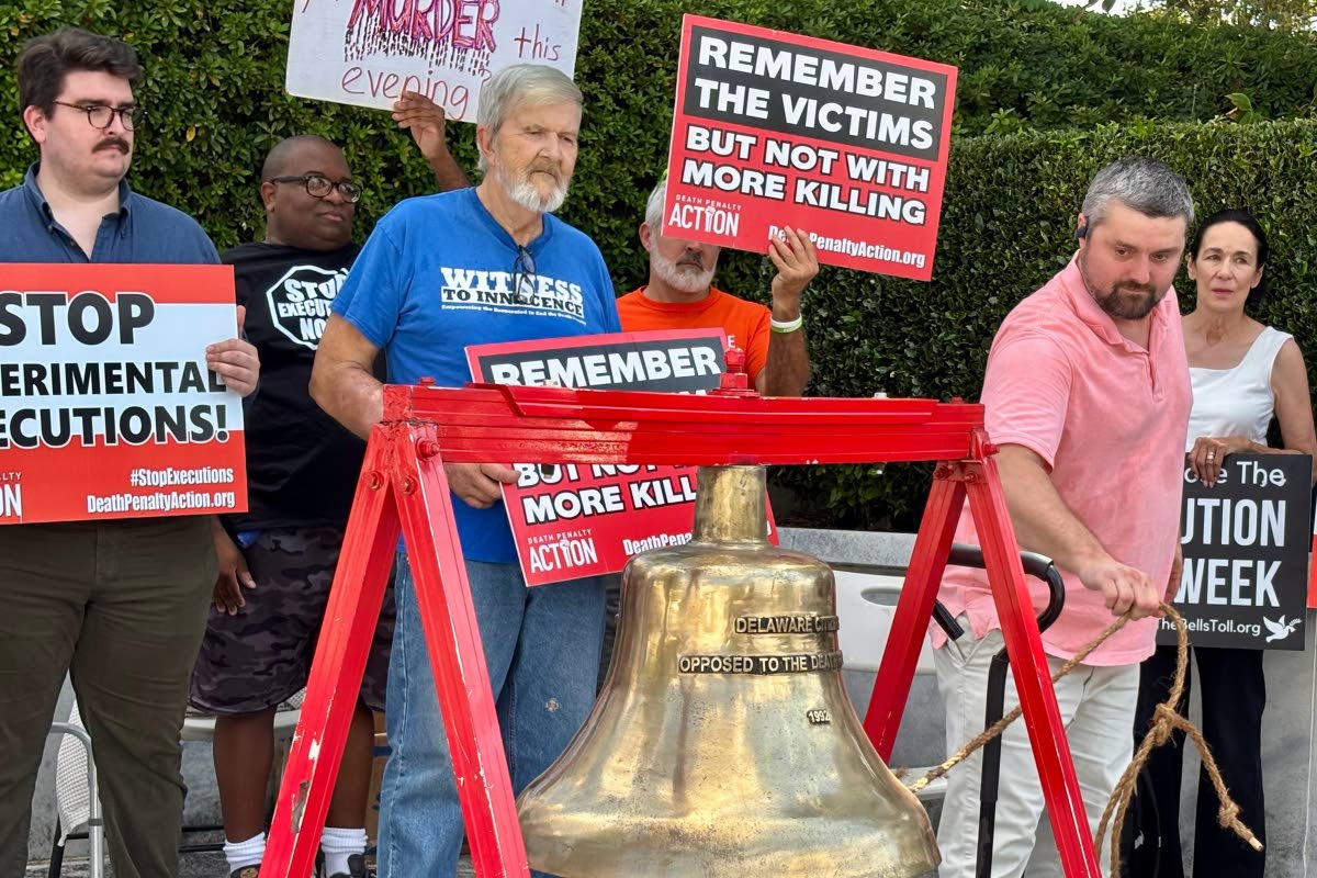 Will Berry rings a bell to symbolize opposition to the death penalty during a protest outside the Capitol in Montgomery, Alabama, on Tuesday, September 23,2025. (AP Photo/Kim Chandler)